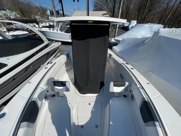 Slide: The Image of 2024 Robalo R270 Center Console boat, spacious deck, sleek design, outdoor setting. - 9