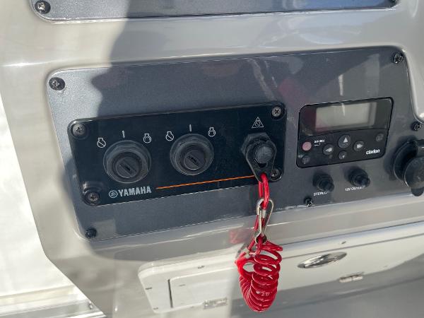 Slide: The Image of Control panel of a 2009 Robalo R305 Walkaround boat with Yamaha switches. - 23