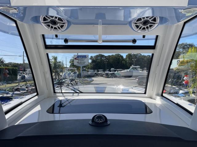 Slide: The Image of Interior view of 2024 Robalo R360 boat with large windows and speakers. - 24