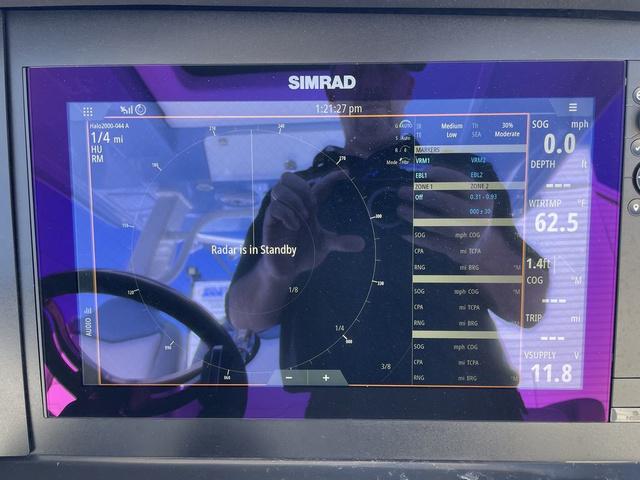 Slide: The Image of Simrad radar display on 2024 Robalo R360 boat showing navigation data. - 27