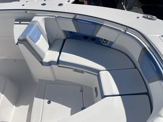 Slide: The Image of 2024 Robalo R360 boat with spacious seating area and storage compartments. - 42