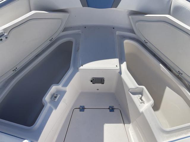 Slide: The Image of 2024 Robalo R360 boat storage compartments and seating area. - 43
