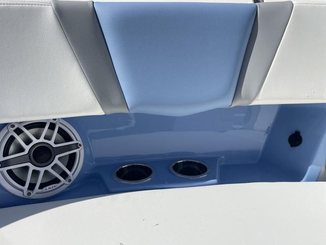 Slide: The Image of 2024 Robalo R360 boat interior with speaker and cup holders. - 44