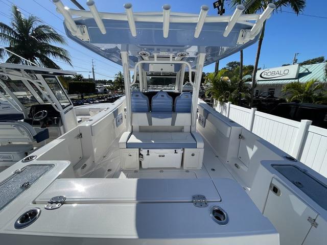Slide: The Image of 2024 Robalo R360 boat interior with seating and storage compartments. - 5