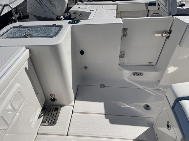 Slide: The Image of 2024 Robalo R360 boat deck with storage compartments and seating. - 8