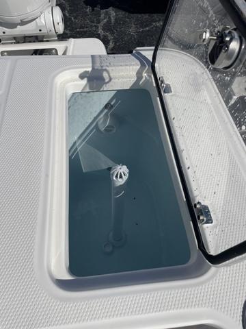 Slide: The Image of 2024 Robalo R360 livewell with open lid. - 9