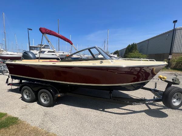 Slide: The Image of 2021 Rossiter 20 Coastal Cruiser boat on trailer with red canopy. - 0