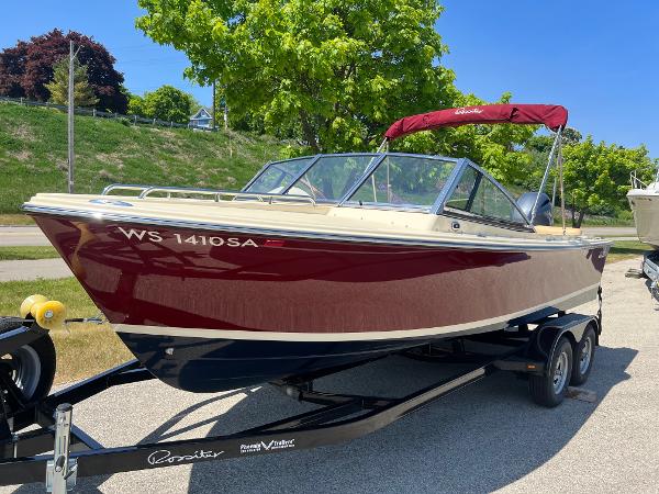 Slide: The Image of 2021 Rossiter 20 Coastal Cruiser boat on trailer with red and beige exterior. - 10