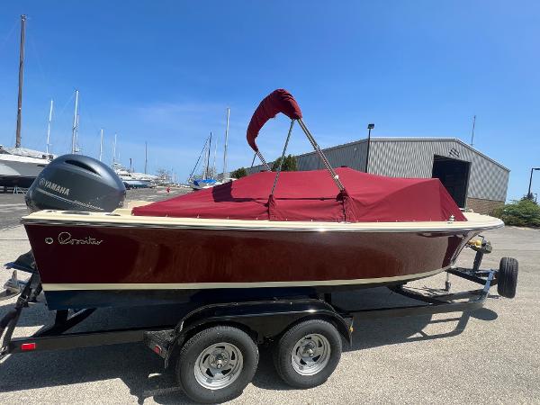 Slide: The Image of 2021 Rossiter 20 Coastal Cruiser boat with red cover on trailer. - 12