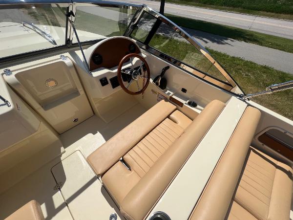 Slide: The Image of 2021 Rossiter 20 Coastal Cruiser interior with tan leather seats and steering wheel. - 22