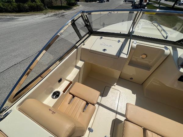 Slide: The Image of 2021 Rossiter 20 Coastal Cruiser boat interior with tan leather seats and windshield. - 23