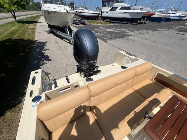 Slide: The Image of 2021 Rossiter 20 Coastal Cruiser boat with outboard motor at marina. - 25