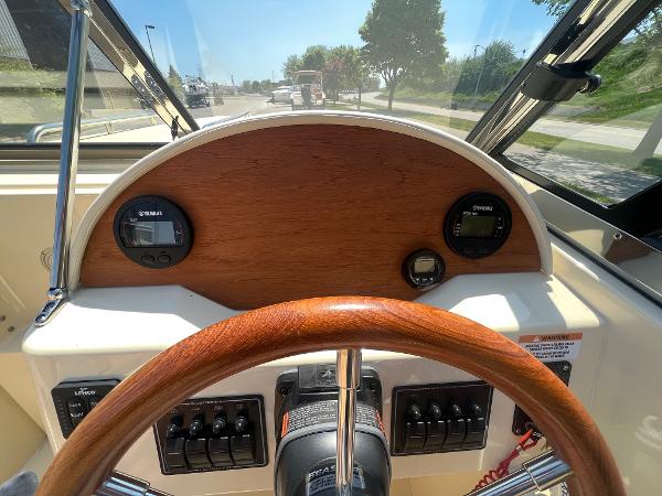 Slide: The Image of 2021 Rossiter 20 Coastal Cruiser dashboard with wooden steering wheel and instrument panel. - 30