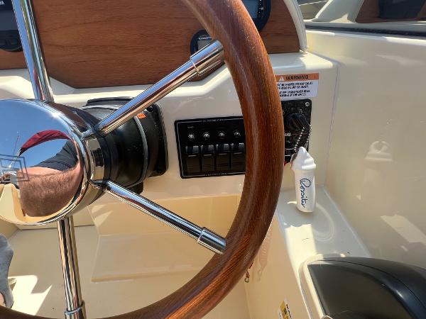 Slide: The Image of 2021 Rossiter 20 Coastal Cruiser steering wheel and control panel. - 31