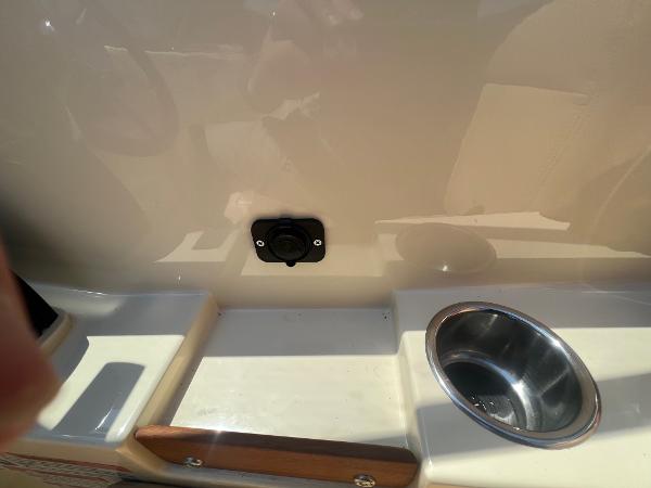 Slide: The Image of 2021 Rossiter 20 Coastal Cruiser interior detail with cup holder and accessory port. - 33