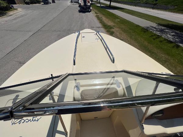 Slide: The Image of 2021 Rossiter 20 Coastal Cruiser boat, front deck view with windshield and railings. - 35