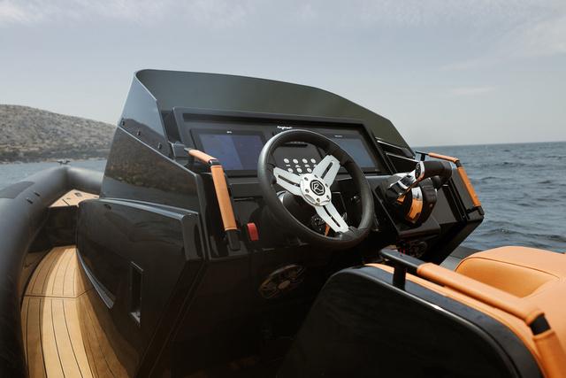 Slide: The Image of Roughneck RIB 1010 boat dashboard, 2022 model, with sleek design and modern controls. - 17