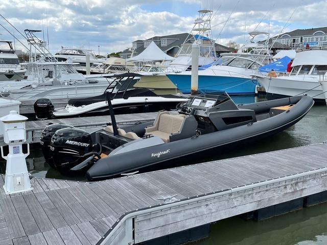Slide: The Image of 2022 Roughneck RIB 1010 boat docked at marina with Mercury engine. - 4