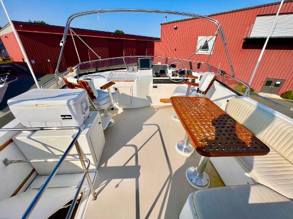 Slide: The Image of 2001 Sabre Sabreline 47 yacht with spacious flybridge and seating area. - 26