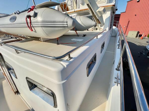 Slide: The Image of 2001 Sabre Sabreline 47 yacht with inflatable dinghy on deck. - 29