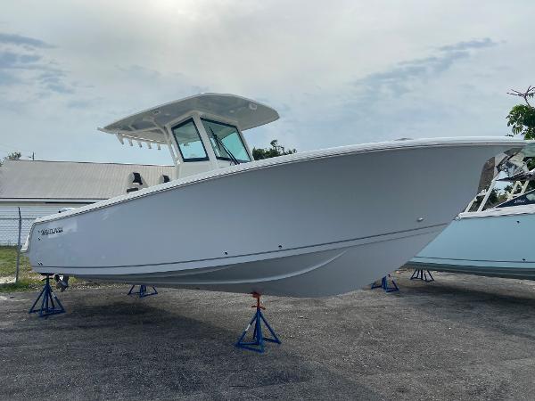 Slide: The Image of 2023 Sailfish 272 CC center console boat on stands, ready for launch. - 11