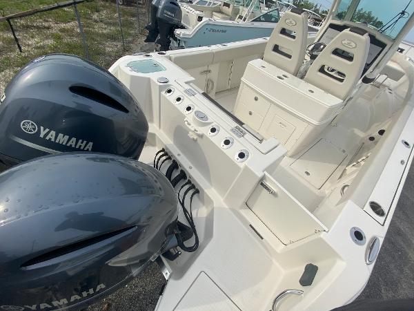 Slide: The Image of 2023 Sailfish 272 CC boat with dual Yamaha outboard engines. - 12