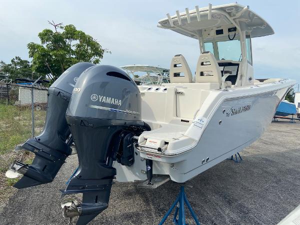Slide: The Image of 2023 Sailfish 272 CC boat with twin Yamaha engines on display. - 13