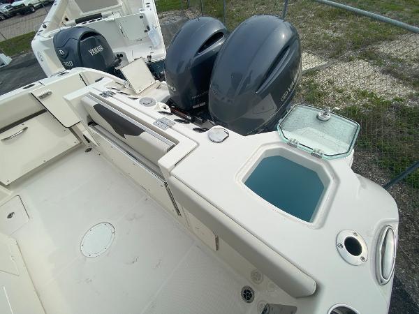 Slide: The Image of 2023 Sailfish 272 CC boat with dual Yamaha engines and livewell. - 17