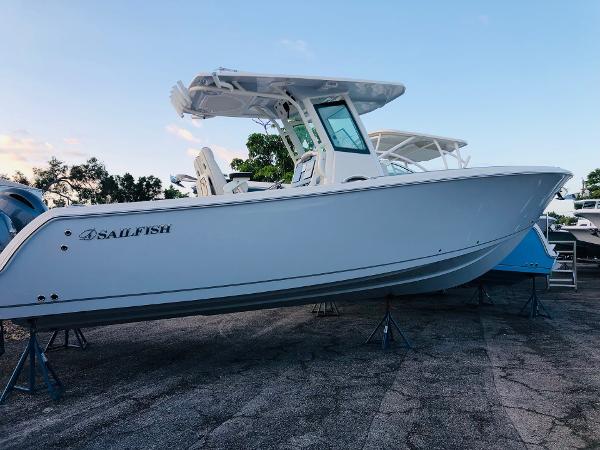 Slide: The Image of 2023 Sailfish 272 CC center console boat on stands. - 2