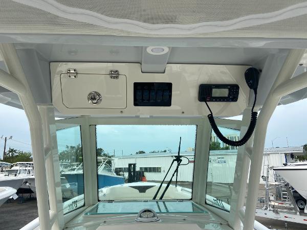 Slide: The Image of 2023 Sailfish 272 CC center console dashboard with electronics and storage compartments. - 22