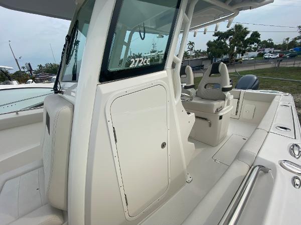 Slide: The Image of 2023 Sailfish 272 CC center console boat interior with seating and storage. - 24