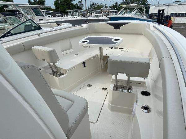 Slide: The Image of 2023 Sailfish 272 CC boat interior with seating and table. - 26