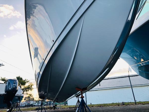 Slide: The Image of 2023 Sailfish 272 CC boat hull on stands, side view. - 7