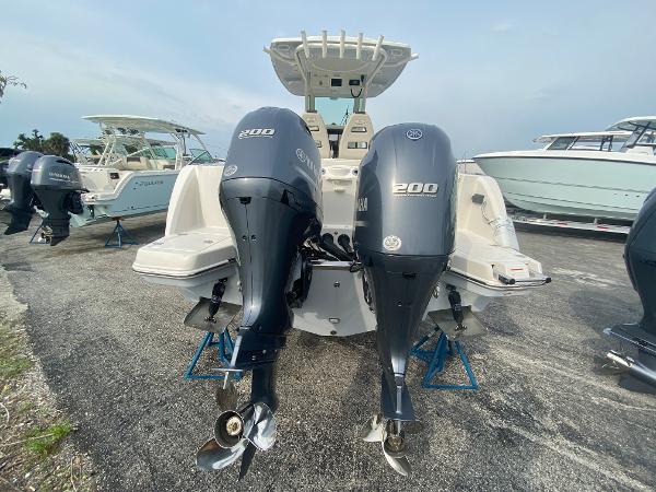 Slide: The Image of 2023 Sailfish 272 CC with twin Yamaha 200 engines in a boatyard. - 9