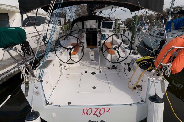 Slide: The Image of Salona 38 sailboat, 2013 model, docked with dual steering wheels and safety equipment. - 10