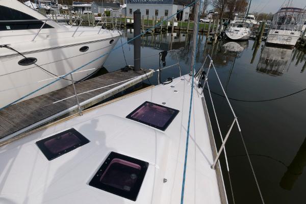 Slide: The Image of 2013 Salona 38 sailboat docked at marina with other boats. - 12