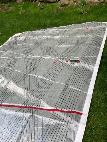 Slide: The Image of Sail from a 2013 Salona 38 yacht laid out on grass. - 16