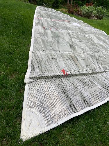 Slide: The Image of Sail from a 2013 Salona 38 yacht laid out on grass. - 18
