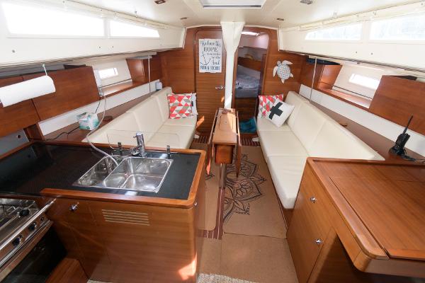 Slide: The Image of Interior of 2013 Salona 38 sailboat with modern kitchen and cozy seating area. - 19