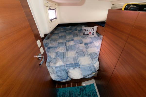 Slide: The Image of Cozy cabin bedroom in a 2013 Salona 38 sailboat with a Hello Sailor pillow. - 24