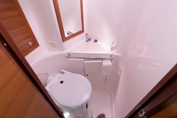 Slide: The Image of Compact bathroom in 2013 Salona 38 sailboat with toilet, sink, and mirror. - 27