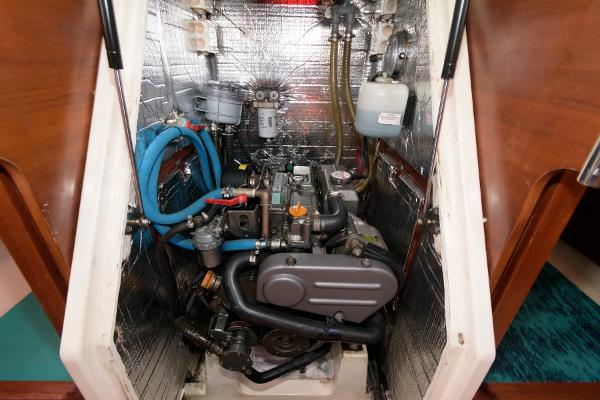 Slide: The Image of Engine compartment of a 2013 Salona 38 sailboat with visible components and insulation. - 28