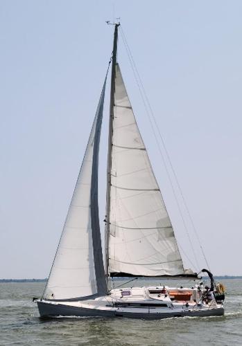 Slide: The Image of 2013 Salona 38 sailboat cruising on open water. - 4