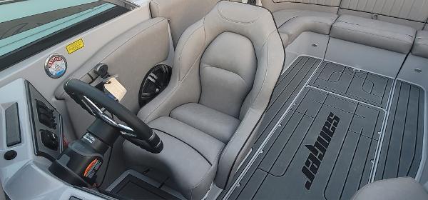 Slide: The Image of Interior of 2023 Sanger 231 SL boat with gray seating and steering wheel. - 36