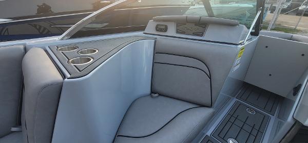 Slide: The Image of Interior of 2023 Sanger 231 SL boat with gray seating and cup holders. - 43