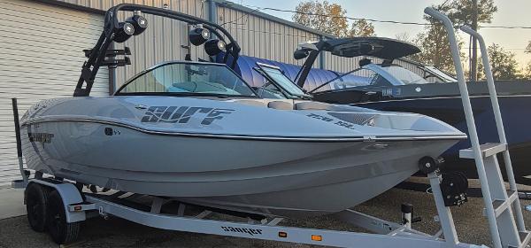 Slide: The Image of 2023 Sanger 231 SL boat on trailer in outdoor storage. - 47
