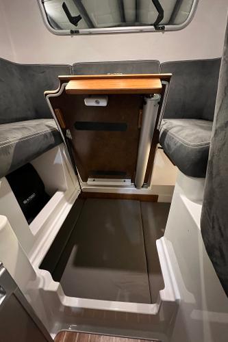 Slide: The Image of Interior seating and table area of a 2021 Sargo 25 boat. - 22