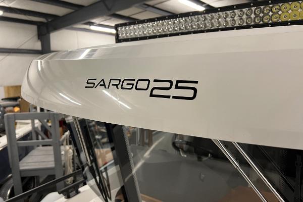 Slide: The Image of Close-up of 2021 Sargo 25 boat model name on white exterior. - 36