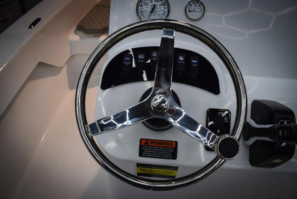 Slide: The Image of Steering wheel and dashboard of 2023 Savannah SS19 boat. - 12