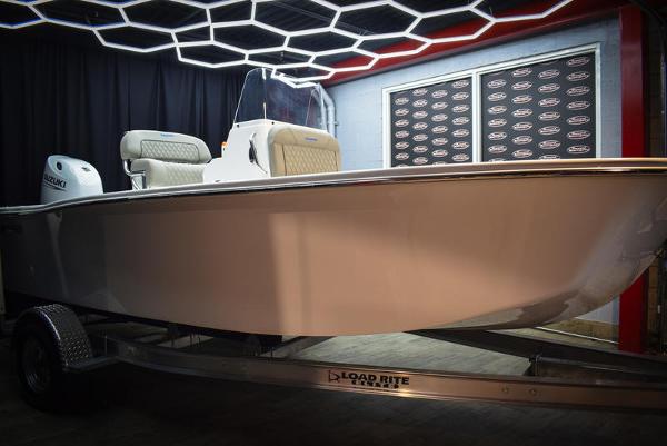 Slide: The Image of 2023 Savannah SS19 boat on Load Rite trailer in showroom. - 7